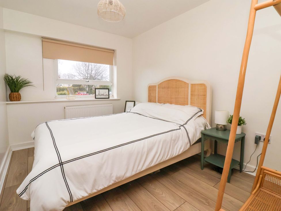 A bedroom with a bed and bedside table at Apartment in Harrogate