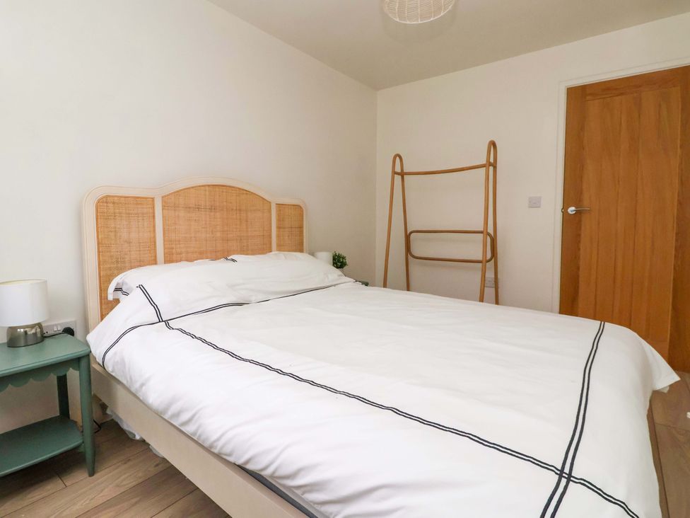 A bedroom with a bed and a bedside table at Apartment in Harrogate