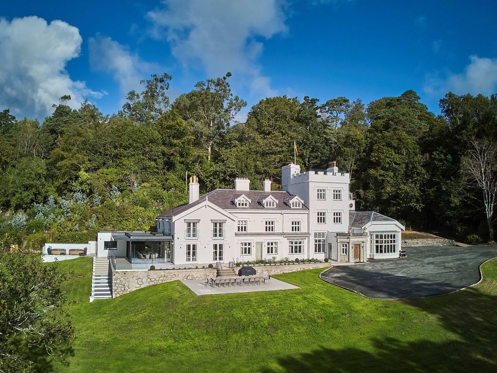 A large house with a terrace and garden at Craig y Don in Glyngarth near Llandegfan