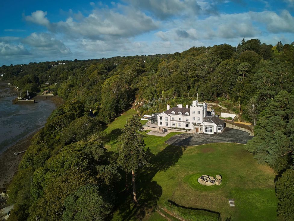 A house with a garden and water view at Craig y Don Glyngarth near Llandegfan
