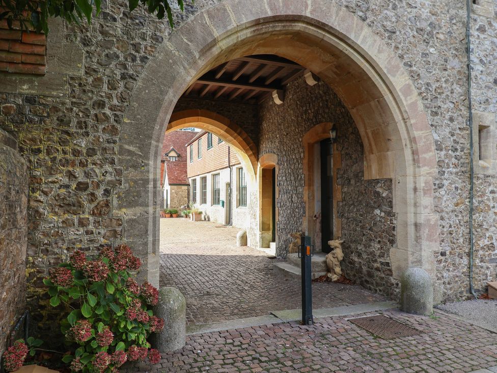 An archway leading to a courtyard at The Clock Tower in Rousdon, Nr Lyme Regis