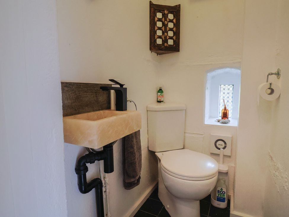 A bathroom with a sink and toilet at The Clock Tower in Rousdon, Nr Lyme Regis
