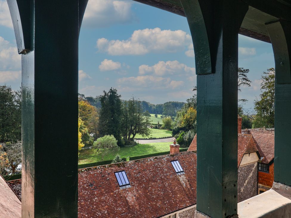 A view of a golf course and trees from a balcony at The Clock Tower in Rousdon, Nr Lyme Regis