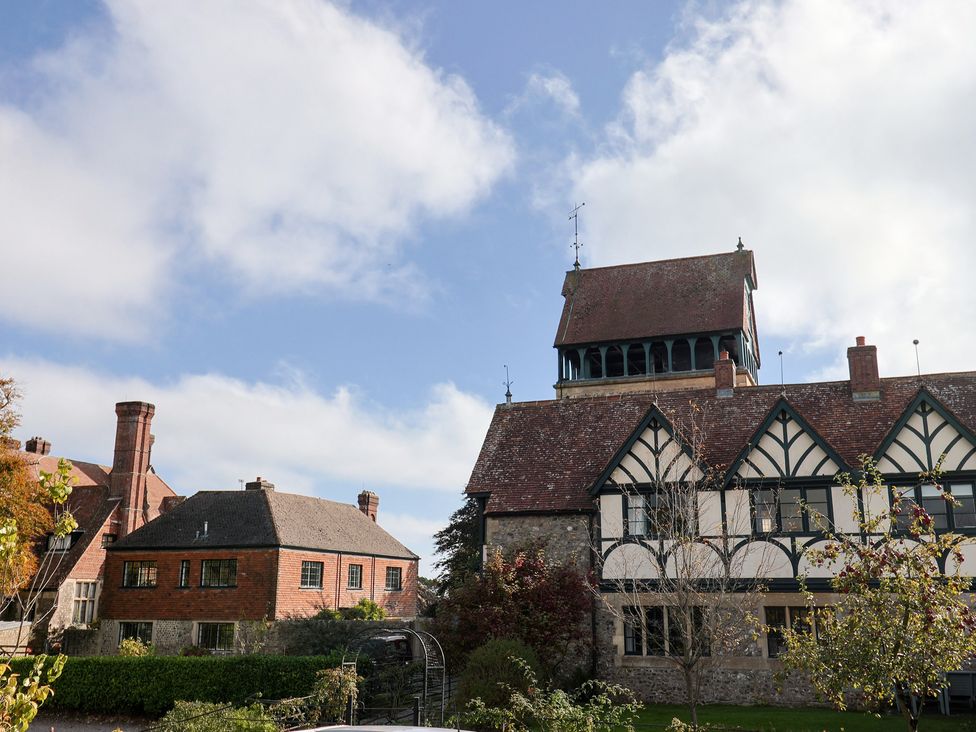A house with a tower and garden at The Clock Tower in Rousdon, Nr Lyme Regis