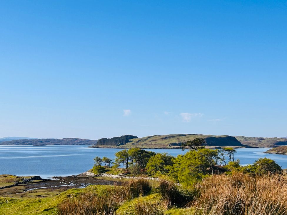A landscape view of water and islands at Bathach Mor in Balvicar, Isle Of Seil