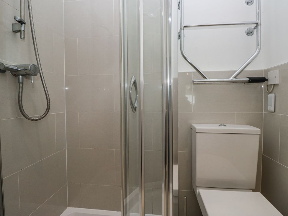 A bathroom with a shower enclosure and a toilet at Sunnycroft in Keswick