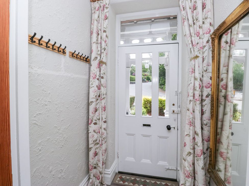 A hallway featuring a front door and coat hooks at Sunnycroft in Keswick