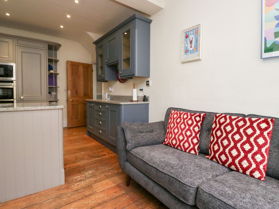A kitchen with a sofa and cabinets at Sunnycroft in Keswick