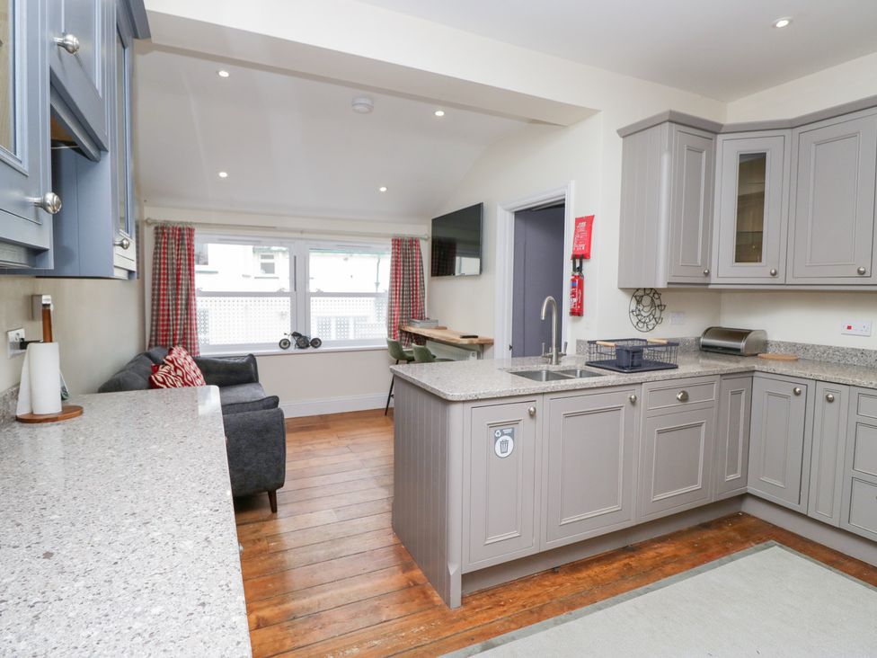 A kitchen with a sink and cabinets at Sunnycroft in Keswick
