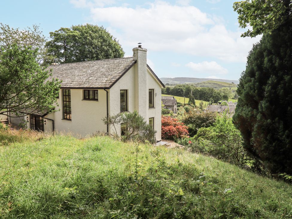 A house with a garden and trees at Rowanhill Kendal