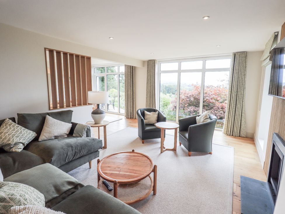 A living room with a sofa and coffee table at Rowanhill in Kendal