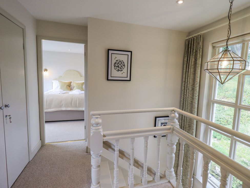 A hallway with a view into a bedroom at Rowanhill in Kendal