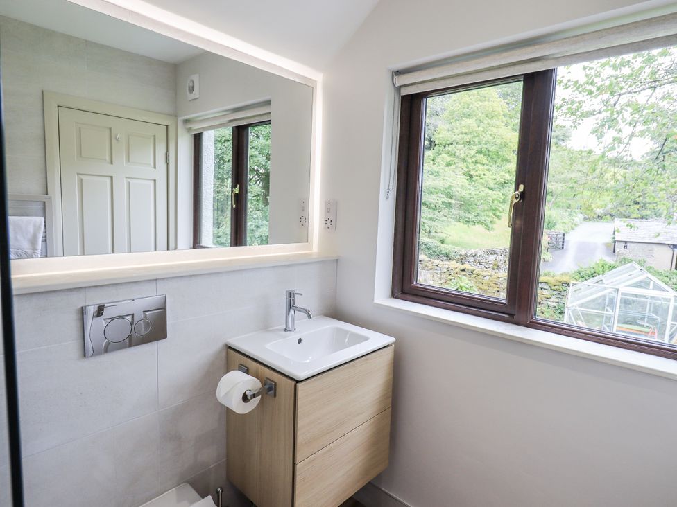 A bathroom with a sink and toilet at Rowanhill in Kendal