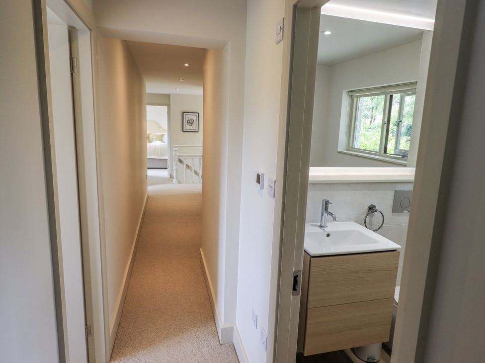 A bathroom with a vanity and sink in a hallway at Rowanhill Kendal