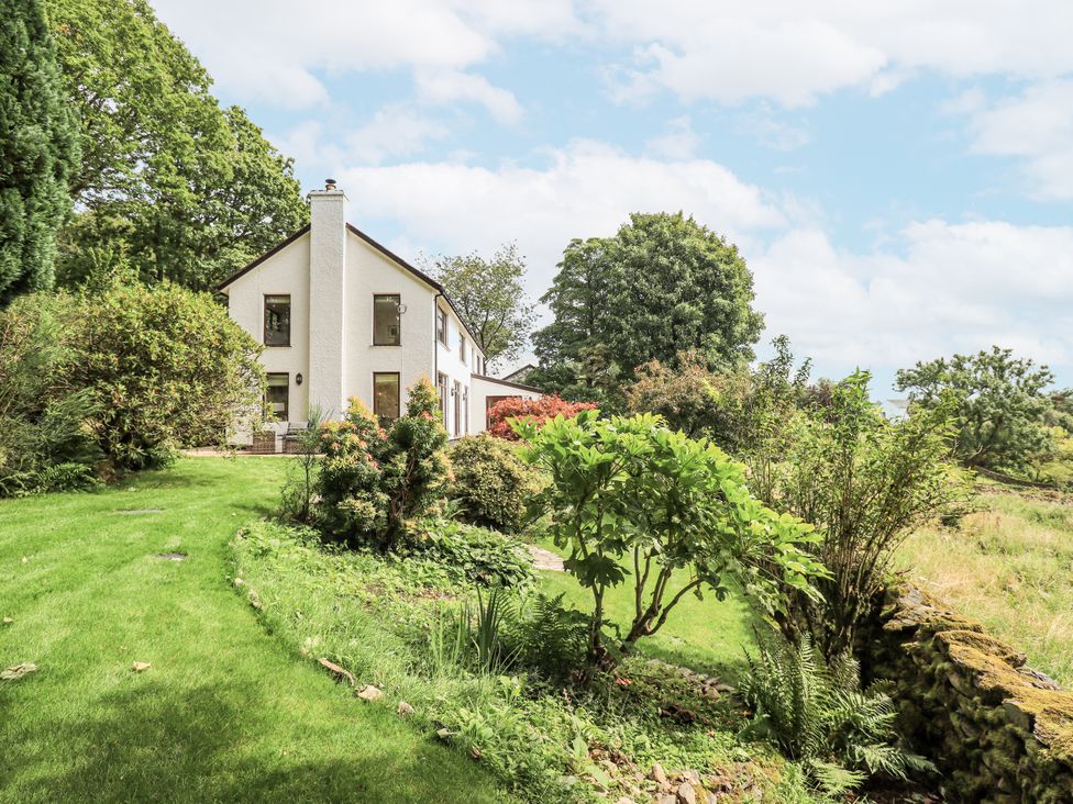 A house surrounded by garden and trees at Rowanhill in Kendal