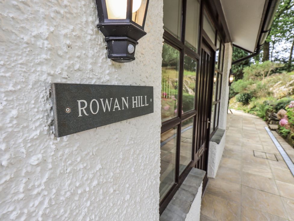A sign labeled Rowan Hill on the outdoor wall at Rowanhill in Kendal