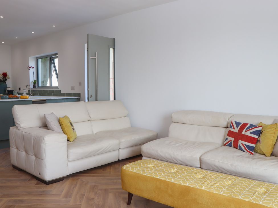 A living room with sofas and a coffee table at Seacroft in Torquay
