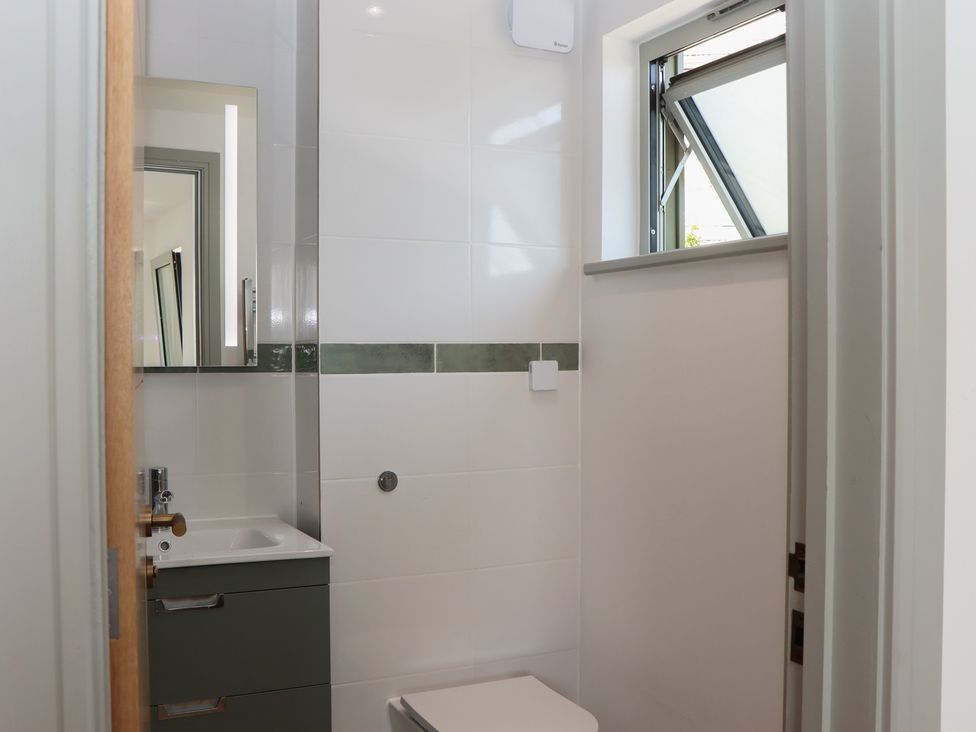 A bathroom with a sink and toilet at Seacroft in Torquay