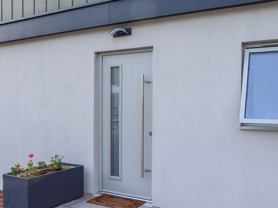 A door with a window next to it at Seacroft in Torquay