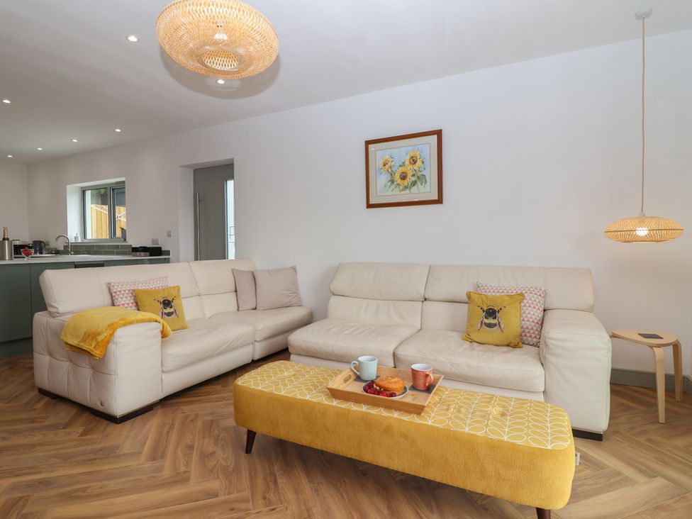 A living room with a sofa and coffee table at Seacroft in Wellswood near Torquay