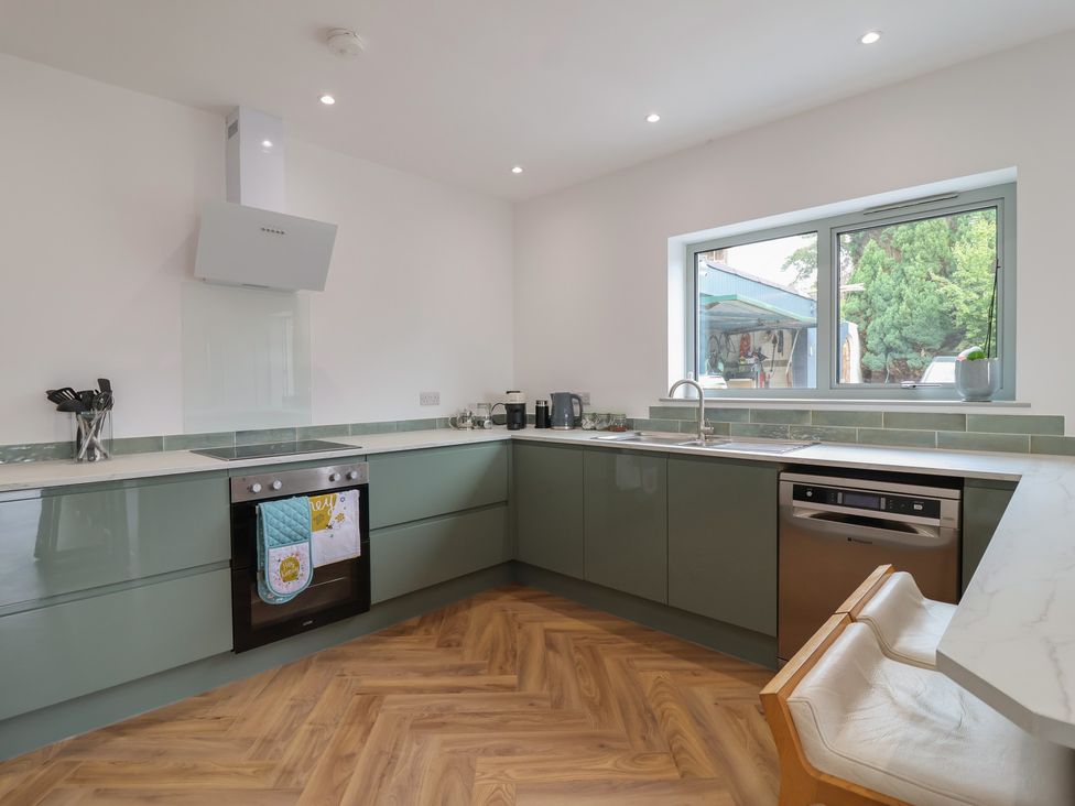 A kitchen with an oven and sink at Seacroft in Wellswood near Torquay