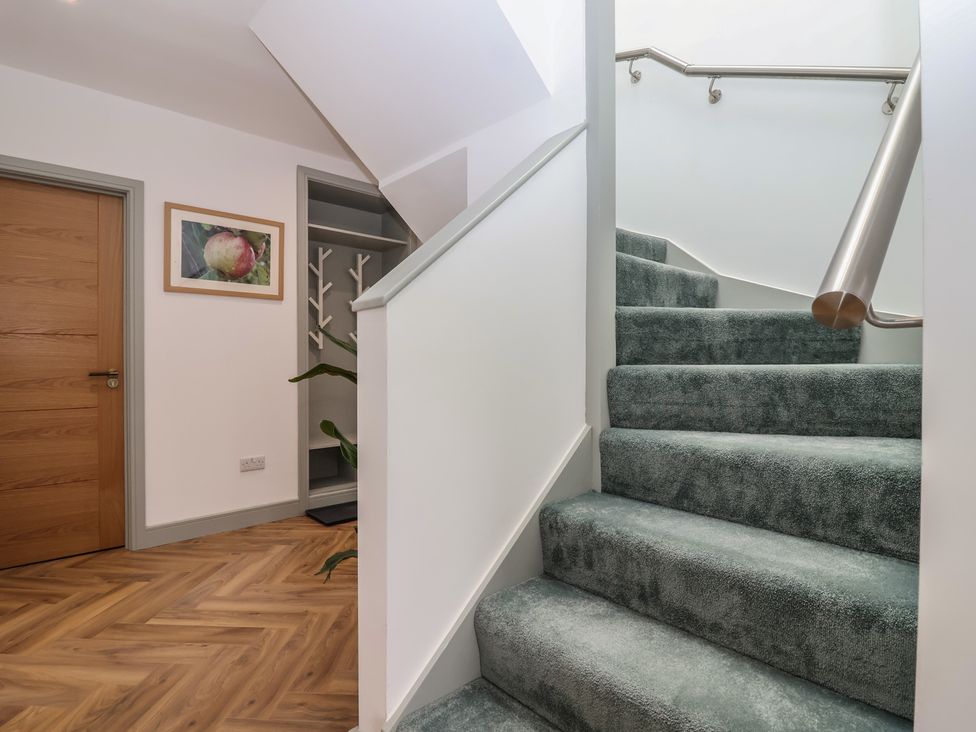 Stairs leading to upper level in a hallway at Seacroft in Wellswood near Torquay
