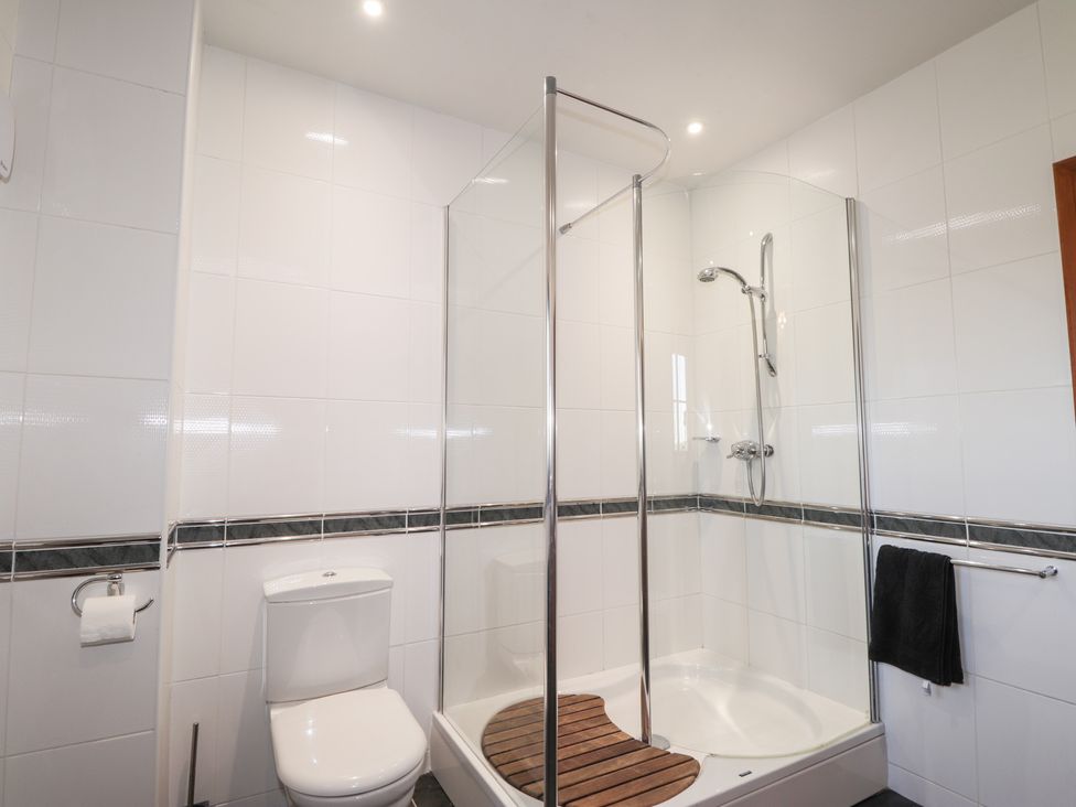 A bathroom with a shower and toilet at Northbanks House in Thurso