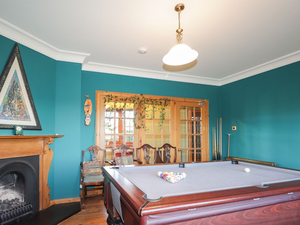 A game room with a pool table and chairs at Northbanks House Thurso