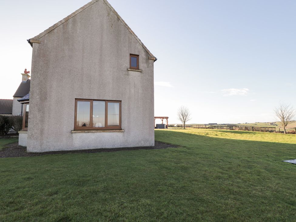 A side view of a house with a garden at Northbanks House in Thurso