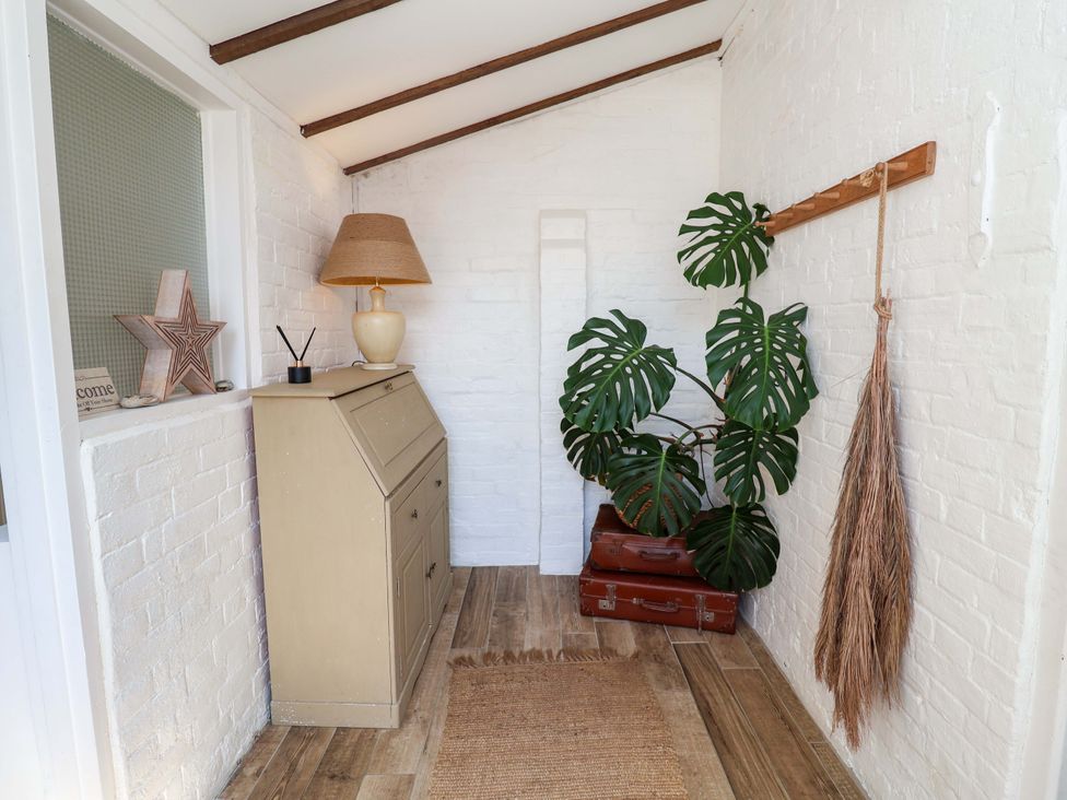 An entryway with a plant and decorative elements at Beehive in Beccles
