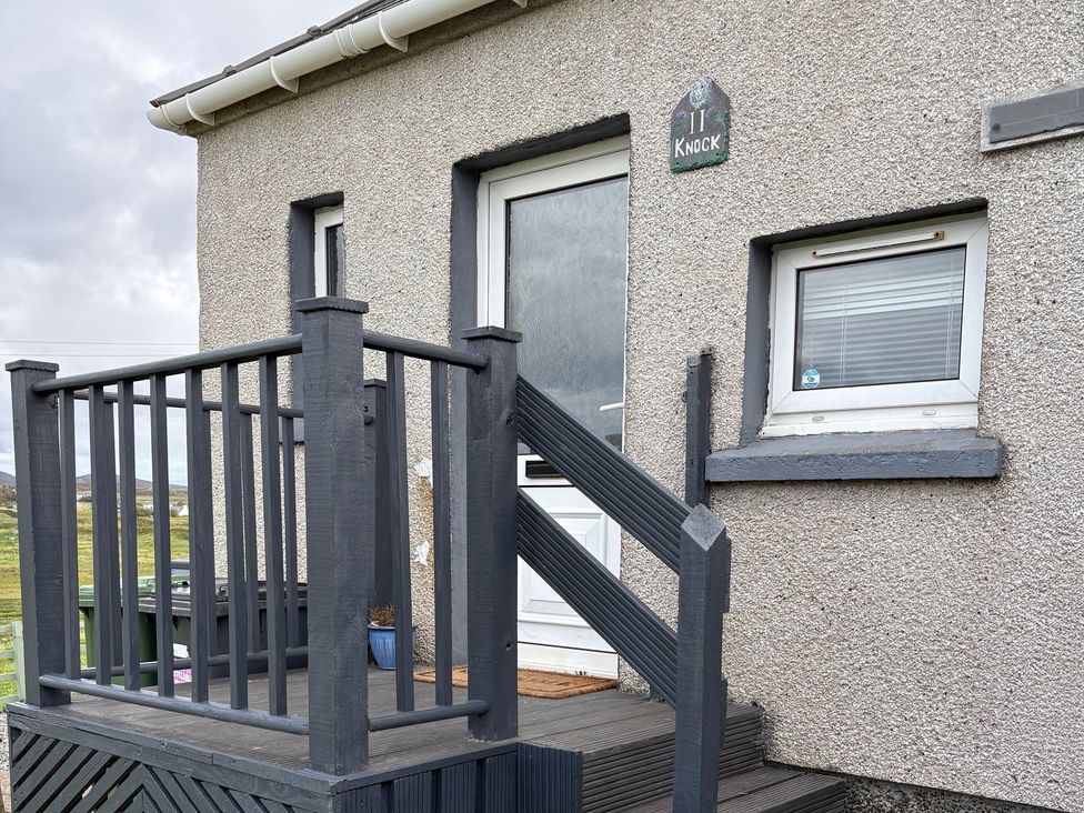 An entrance with steps and a front door at 11 Knock in Carloway