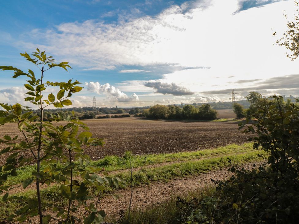A view of fields and trees under a cloudy sky at Lodge 1 in Stockton-on-Tees