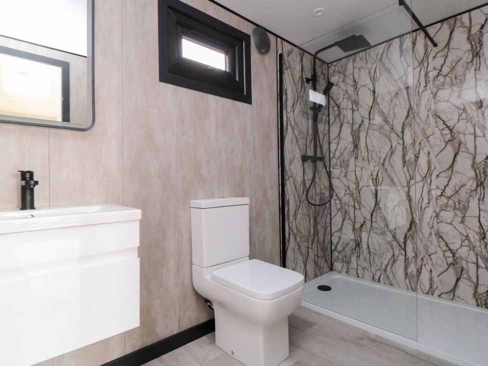 A bathroom with a toilet and shower at Lodge 3 Stockton-on-Tees