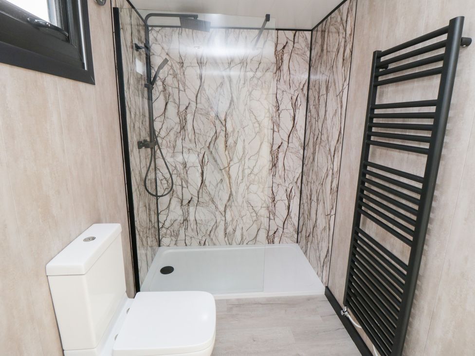 A bathroom with a shower and toilet at Lodge 3 Stockton-on-Tees