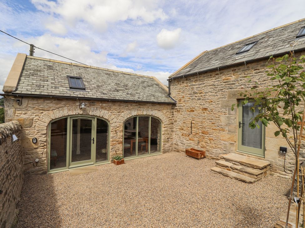 An outdoor area with stone building and gravel ground at West Dunkirk Hemmels Hexham