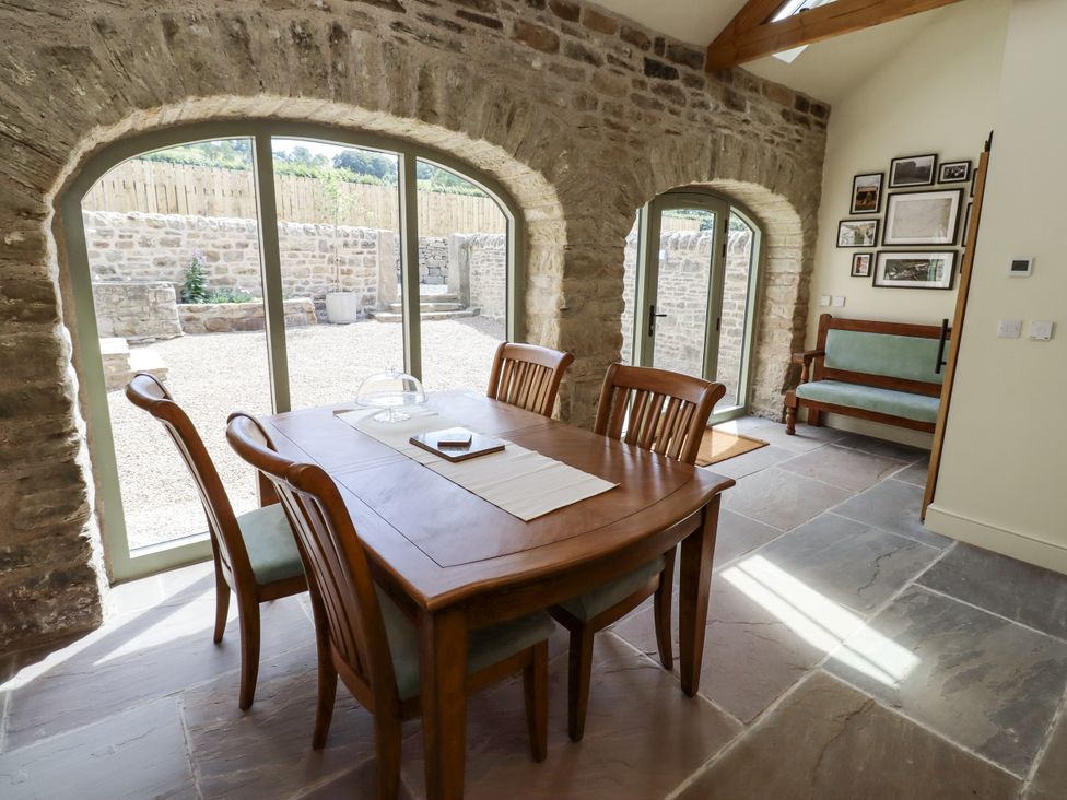 A dining room with a table and chairs at West Dunkirk Hemmels Hexham