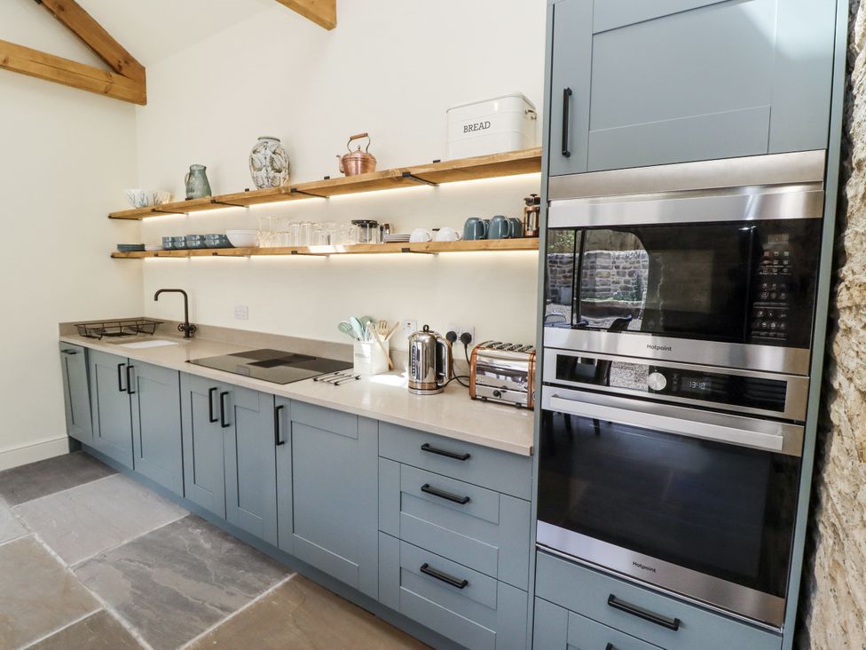 A kitchen with cabinets and appliances at West Dunkirk Hemmels in Hexham