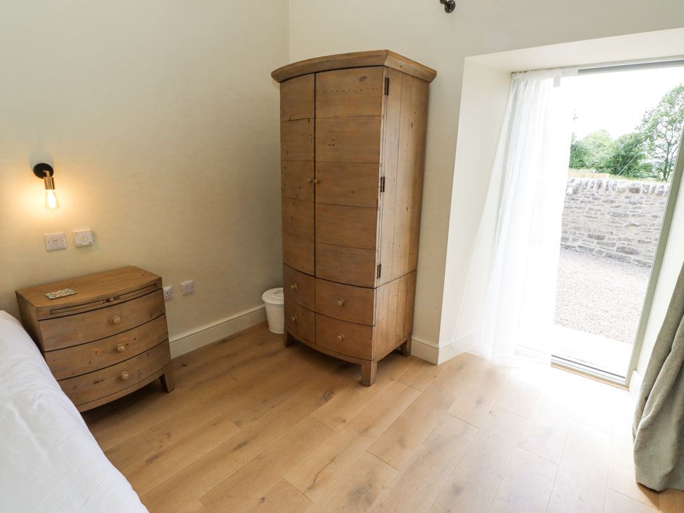 A bedroom with a wardrobe and chest of drawers at West Dunkirk Hemmels Hexham