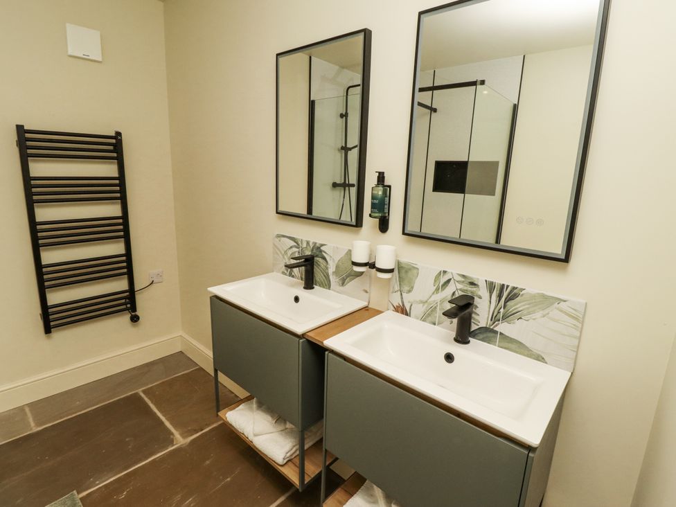 A bathroom with two basins and mirrors at West Dunkirk Hemmels in Hexham