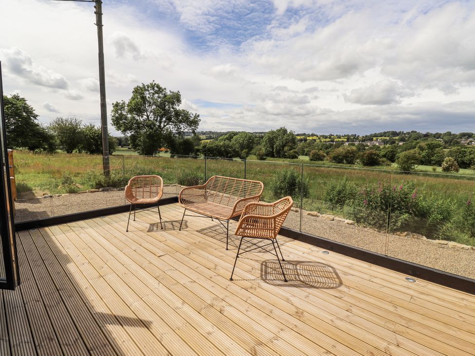 An outdoor seating area with chairs and a view at West Dunkirk Hemmels Hexham