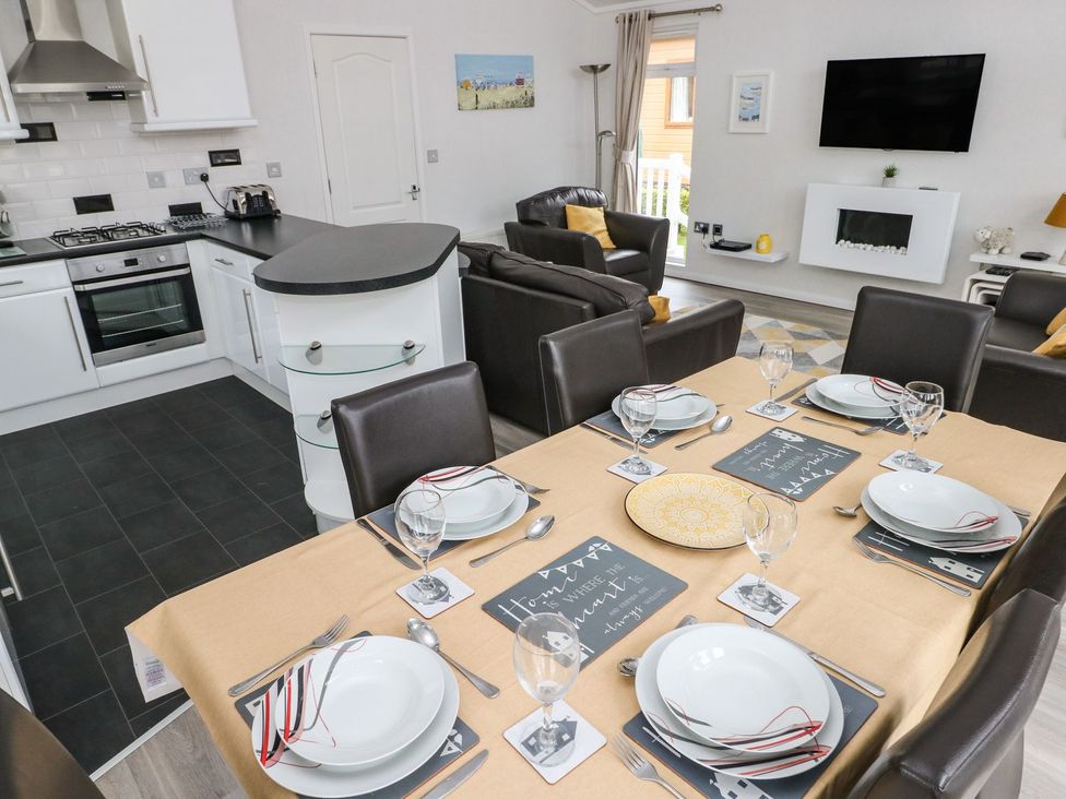 A dining room with a table set for dinner at Erisa in 