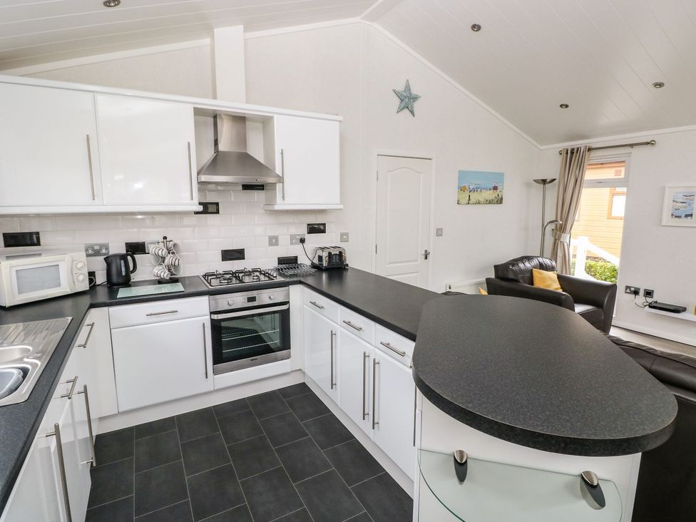 A kitchen with modern appliances at Erisa