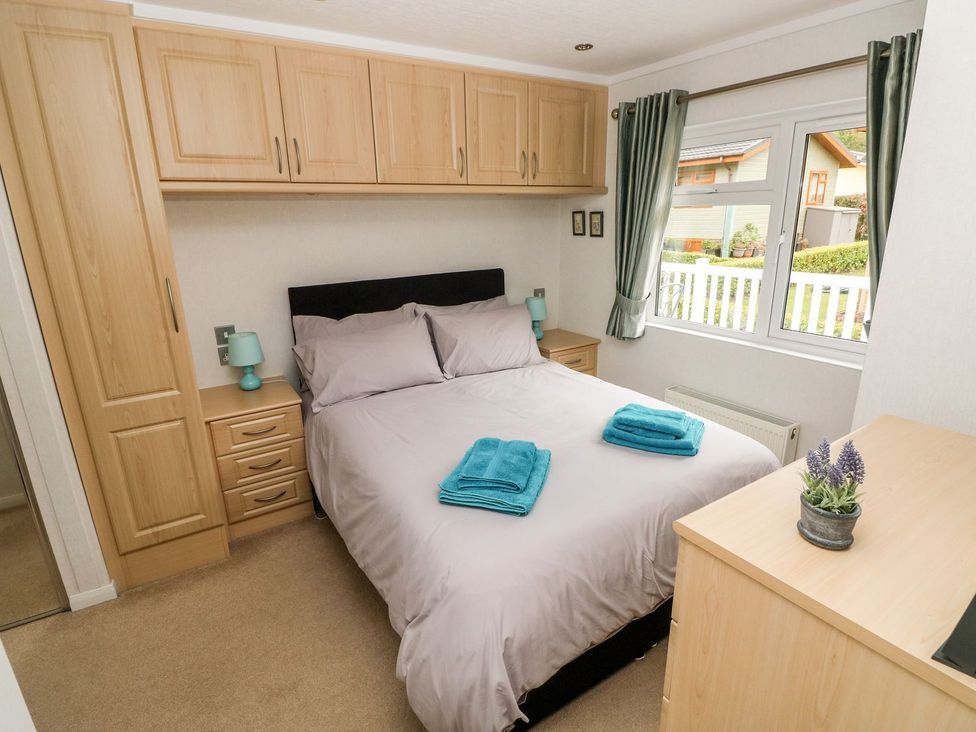 A bedroom with a bed and wardrobe at Erisa