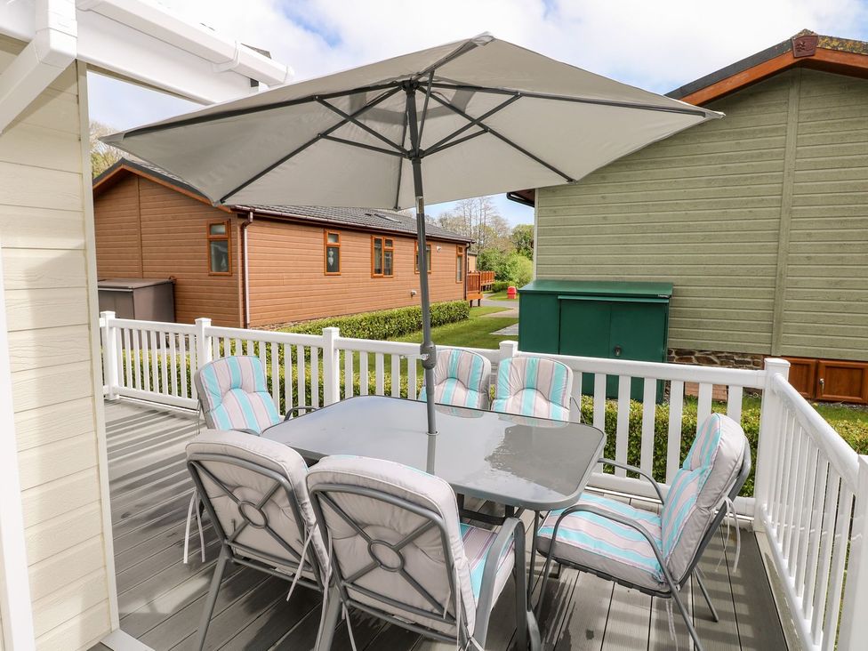 An outdoor dining area with a table and chairs at Erisa 