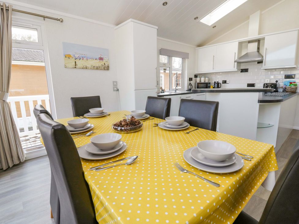 A dining room with a table set for meals at Erisa in Stepaside