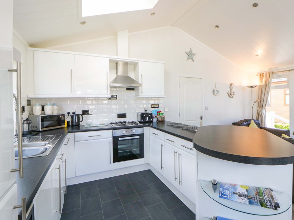 A kitchen with appliances and fixtures at Erisa in Stepaside