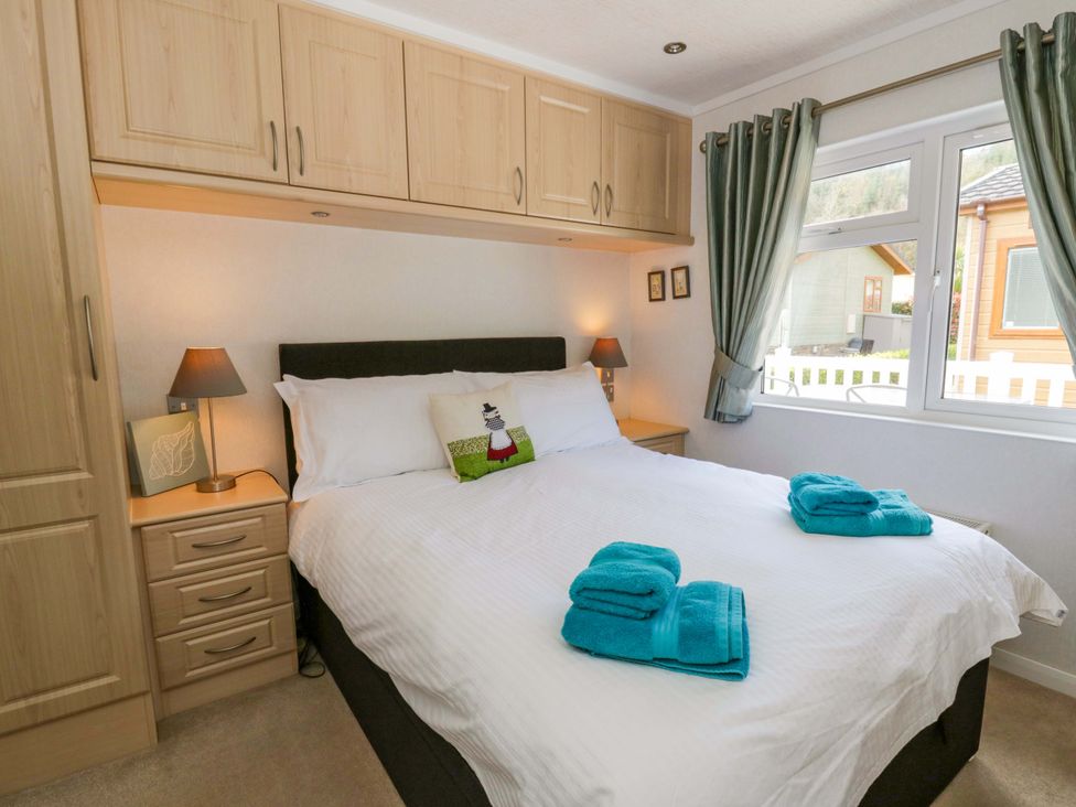 A bedroom with a bed and wardrobe at Erisa in Stepaside