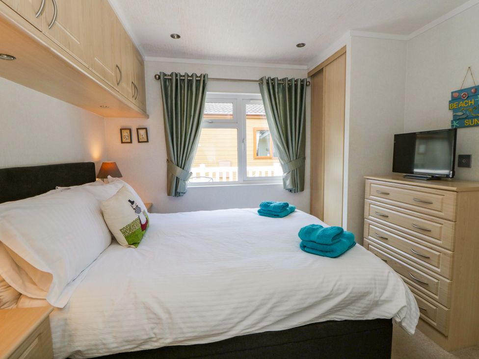 A bedroom with a bed and dresser at Erisa in Stepaside