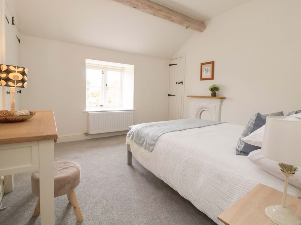A bedroom with a bed and window at Isfryn
