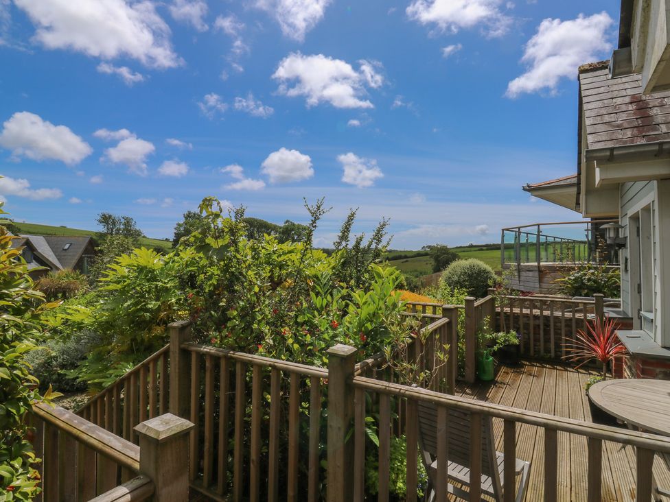 A garden with decking and plants at 2 Court Cottage Dartmouth